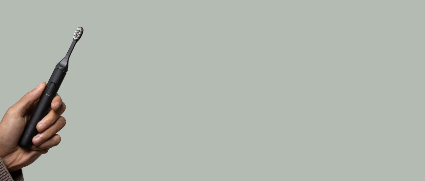 Customer holding Suri in hand